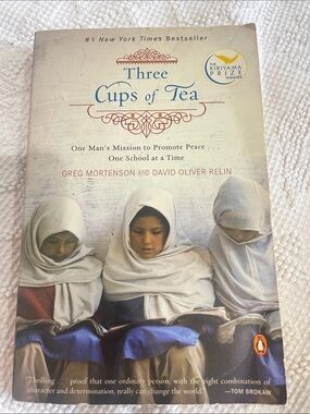 Three Cups of Tea paperback book - cream, blue